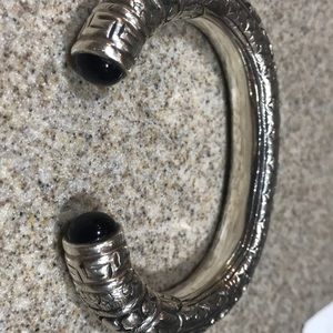 Open-end sterling silver cuff bracelet.
